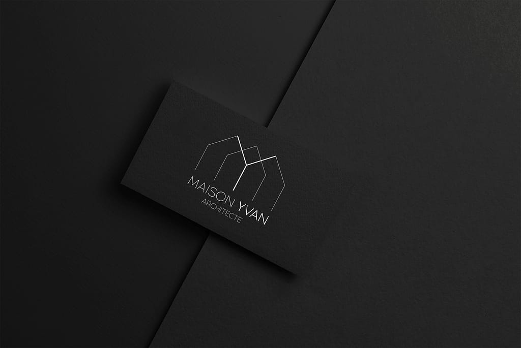 Logo sobre et épuré créé par Mogo graphiste, reprenant l'idée de l'architecture avec un design simple de maisons reconnaissables par les toits. Les trois maisons forment aussi le M et le Y de Maison Yvan